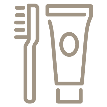 An outline style icon depicting a toothbrush and toothpaste tube, both standing upright